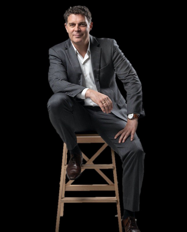 Koert Breebaart, seated on a stool